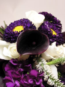 unique bouquet with deep purple calla lilly