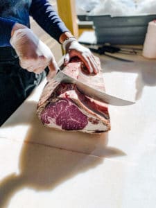 Dry Aged Ribeye Primal being cut and trimmed.