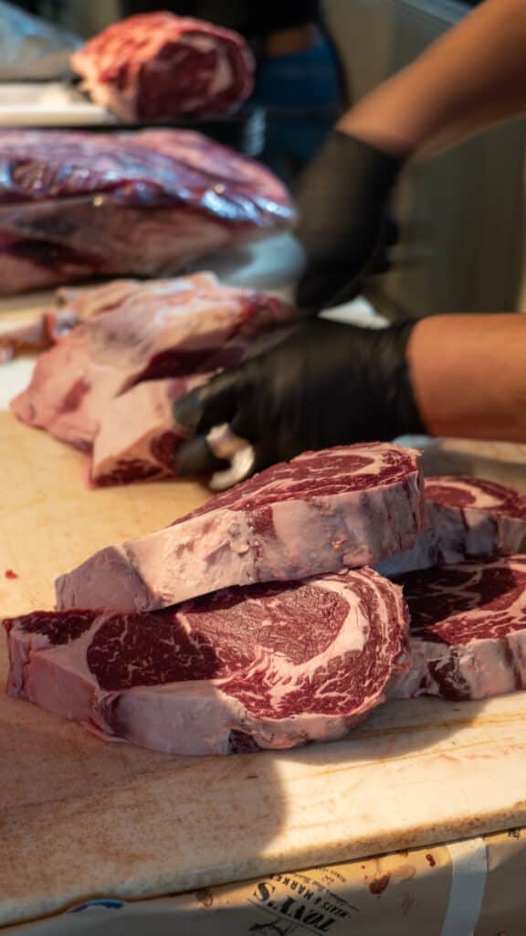 Cutting and Packaging ribeye steaks at Tony's Butcher Days